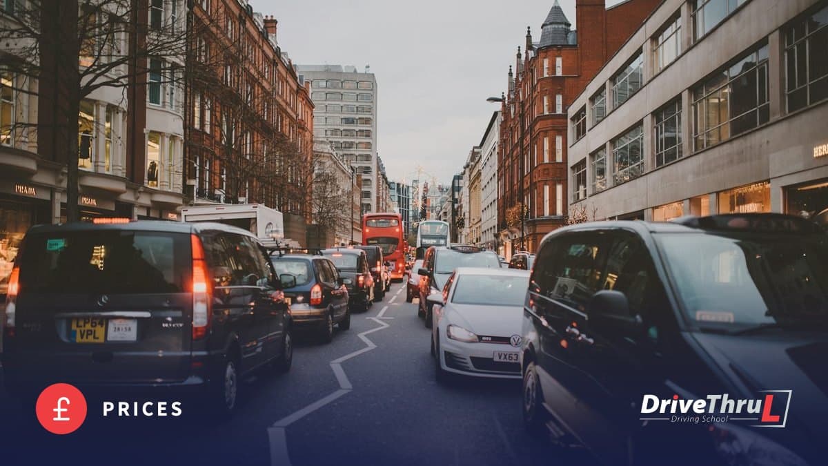 Taxis and cars queueing in London traffic