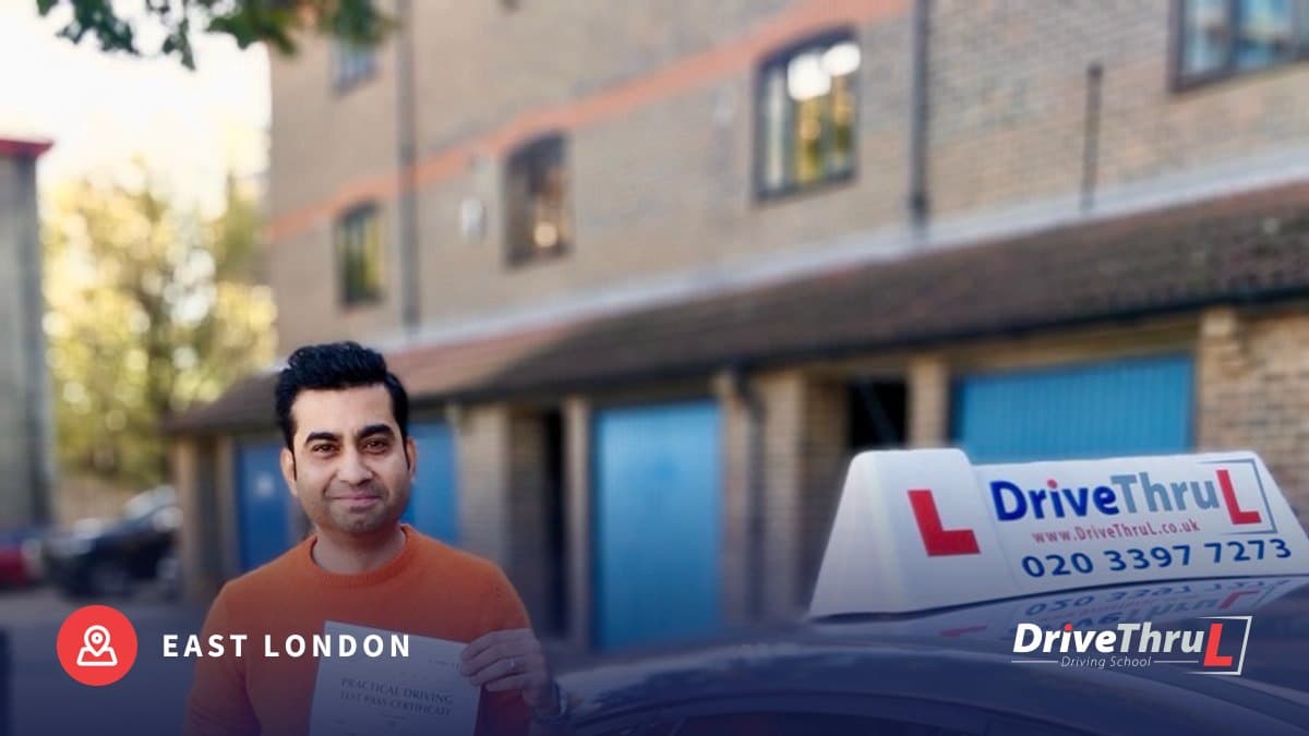 DriveThruL instructor and pupil with a pass certificate