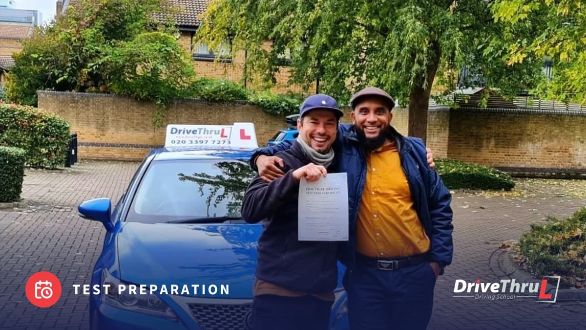 DriveThruL pupil and instructor with a pass certificate beside the car