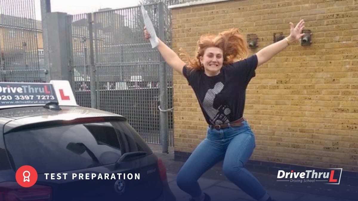 DriveThruL pupil jumping for joy after passing her driving test