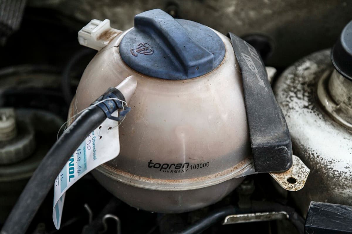 A coolant expansion tank in an engine bay