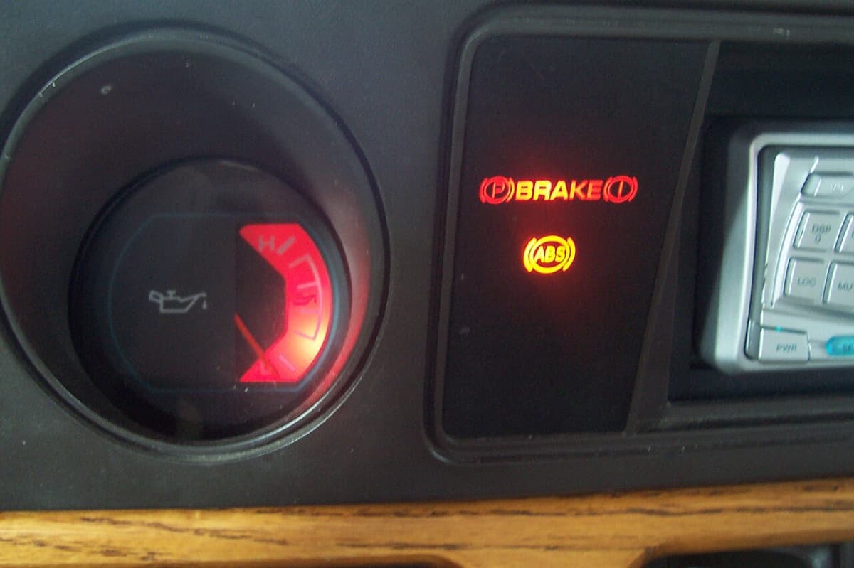 An amber ABS warning light lit on a dashboard