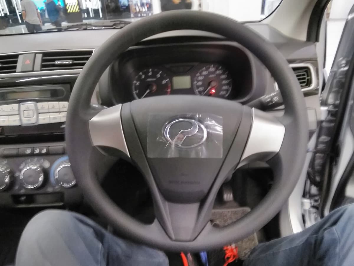 A steering wheel seen from the driver's seat