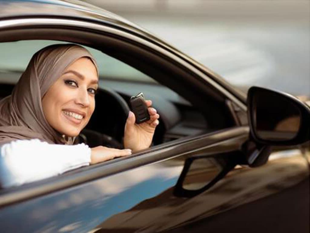 Female driving instructor teaching a learner in East London
