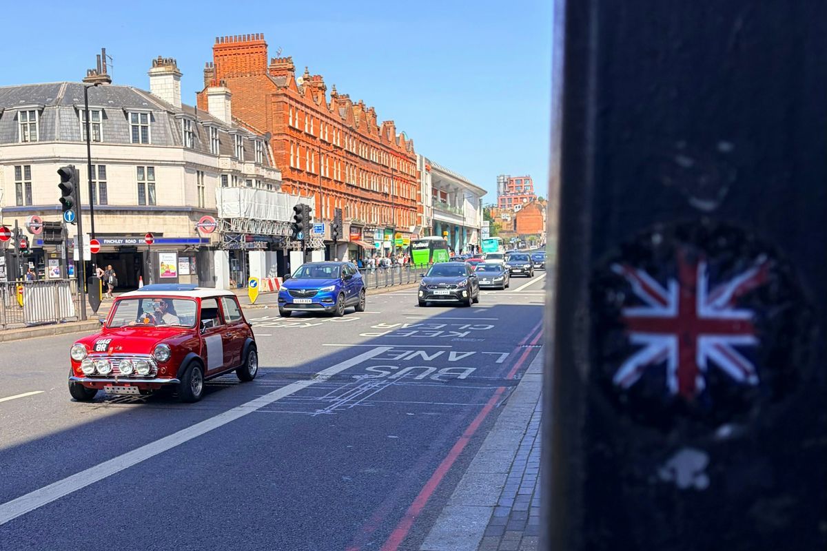 A London bus lane, with traffic in the lane beside it