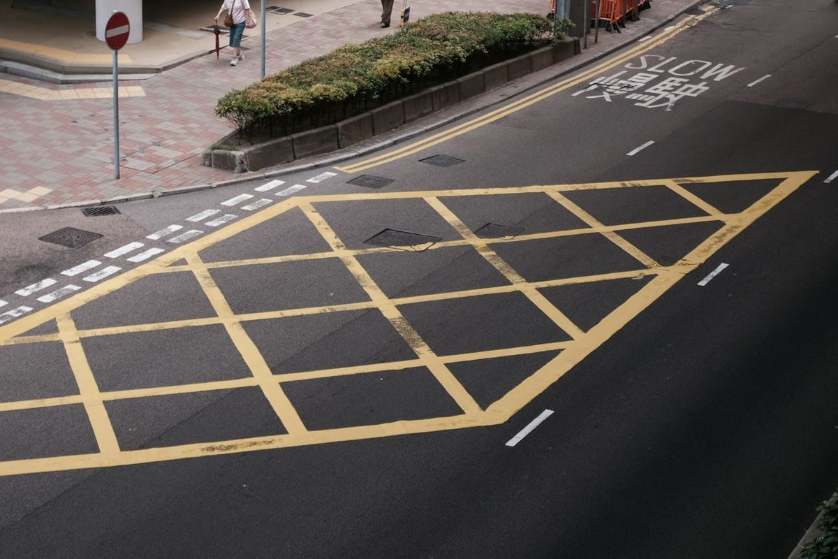 Yellow box junction and road markings at a town junction